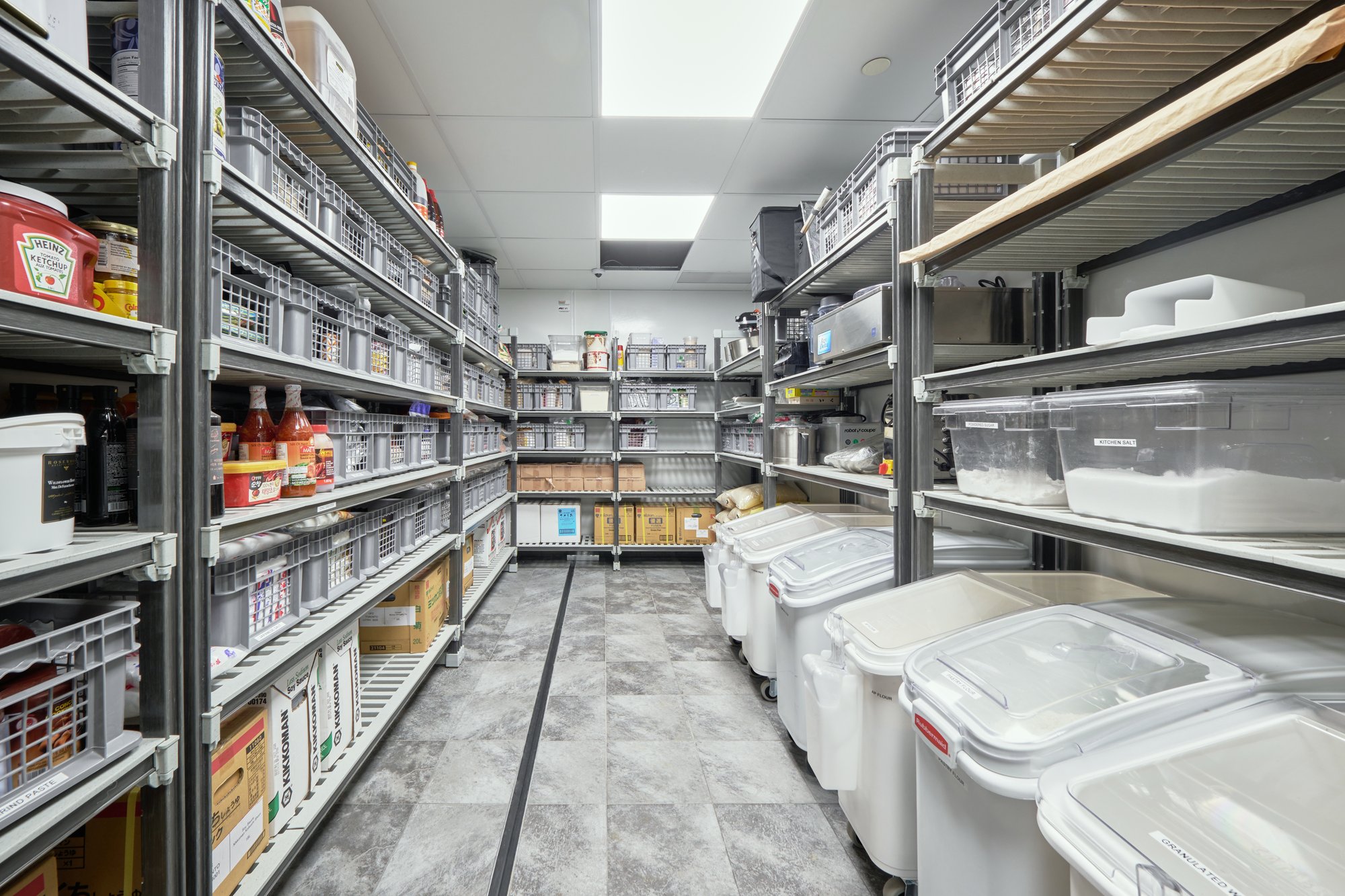 Commercial stainless kitchen line prepared for hospitality service